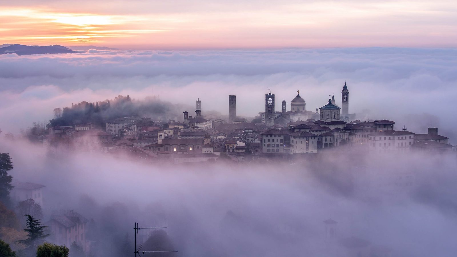 plan a northern italy road trip and drive from Milan to Venice via Bergamo, a beautiful historical city with preseved Venetian ofrtress walls.