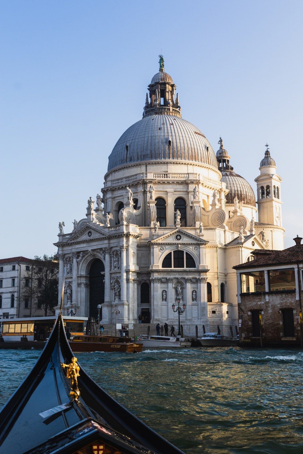 A grand church sits along the ancient Venetian waters