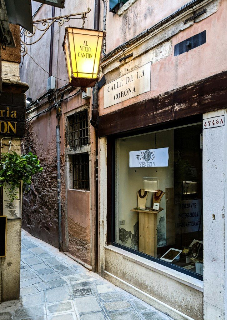 A ceramics shop on a cobbled street in Italy