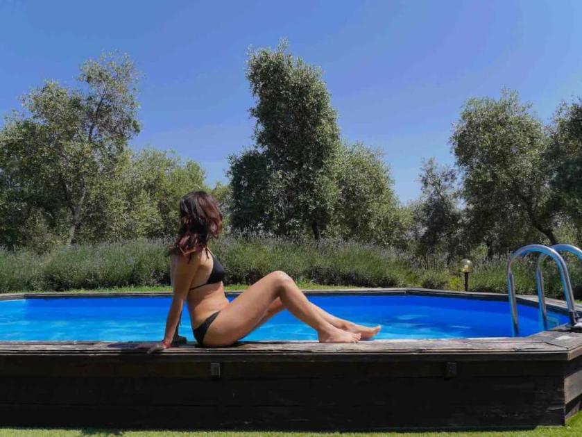 A swimmer relaxing by the pool at an agriturismo in southern Tuscany
